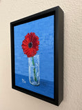 Hello - Single Deep Red Gerbera Daisy Placed in Cylindric Glass Vase with Cobalt Blue Background Oil Painting 7x5x.125 inches on panel with black floater frame by Trae Mundt.