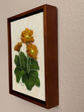 Faith, Hope, Charity is an oil painting by artist Trae Mundt. Three yellow-orange daisies atop green leaves with a yellow cream textured background. . Entire painting painted with a palette knife. Walnut finish frame.