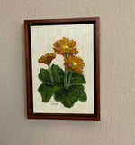 Faith, Hope, Charity is an oil painting by artist Trae Mundt. Three yellow-orange daisies atop green leaves with a yellow cream textured background. . Entire painting painted with a palette knife. Walnut finish frame.